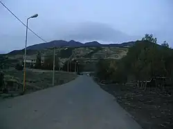 A road leading to Mount Etna on an overcast day.