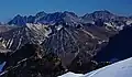 Napeequa Peak centered in the mid-distance with Cirque Mountain to its immediate left. Lined up in the back are the Entiat Mountains: Copper, Fernow, Seven Fingered Jack, and Maude