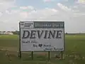 2008 picture of Devine entrance sign: "Small City, Big Heart, Great Future"
