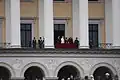 The royal family standing on the palace balcony