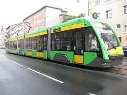 Yellow and gree five-section tram