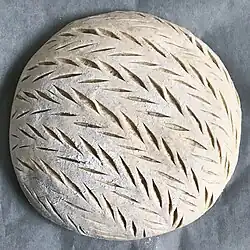 Sourdough scored with lame, before baking