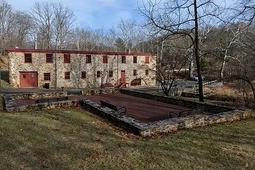 Southern Elevation of Mill Building including the foundation footprint of the Baughman Home (c. 1700s, burned down in 1987)