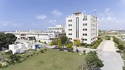 A look at the southern entrance of the Turkish-Palestinian Friendship Hospital and the IUG Faculty of Medicine. The TİKA logo can be seen on the main entrance.