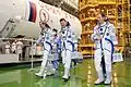 Crew members during a suited "fit check" of the Soyuz TMA-07M spacecraft at the Baikonur Cosmodrome.