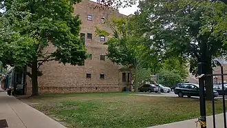 A patch of grass in front of a building