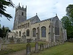 A stone church with a Gothic tower