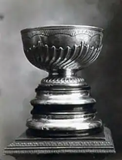 Silver trophy with bowl on top