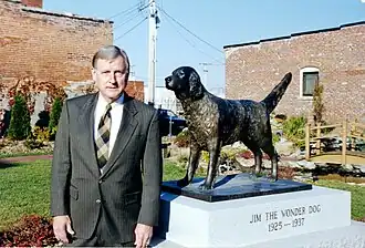 Carnahan posing by a statue of Jim the Wonder Dog in 1999