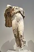Nike statuette, the central akroterion on the west pediment of the temple of Asclepius in Epidaurus; marble, H. 2' 9" (0.85 m), Athens, National Archaeological Museum 155 (c. 380-370 BC).[127]