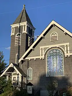 The facade of Steeplejack Brewing Company showing stained glass window