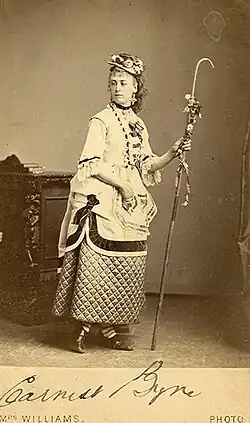 Boulton, dressed as a shepherdess, holding a crook