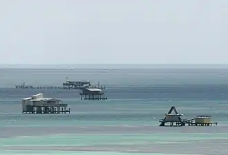 Buildings on pilings in the shallow water of Biscayne Bay