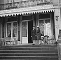 Princess Juliana (right) and her adjunct Rie Stokvis stand on the portico overlooking the front drive
