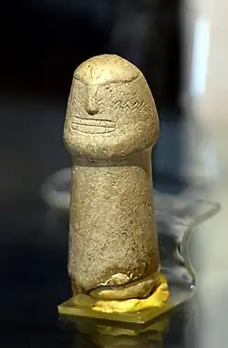 Phallic sculpture with engraved human figure. Nemrik - Iraq (7800–6500 BC). National Museum of Iraq - Baghdad.[27]