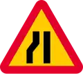 Road narrows on left sides