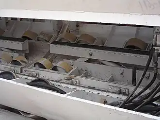 Detail of tunnel boring machine showing wheels that allow the machine to roll along the round contoured concrete track. June 10, 2006.