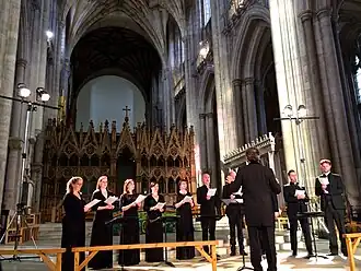 choir standing in a cathedral nave