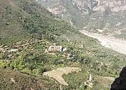 Greek Orthodox Monastery of the Holy Archangels (Pammegiston Taxiarchon), Aigialeia, Greece. View from the rock of the hermitage of Saint Leontius. The Honorable Body of Saint Leontius is kept inside the monastery church.