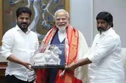 Chief Minister of Telangana Shri Revanth Reddy and Deputy Chief of Telangana Minister Shri Bhatti Vikramarka Mallu handing over an idol of a cow to Prime Minister of India Narendra Modi in New Delhi on 4th July, 2024