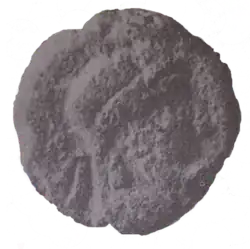 clay piece bearing a depiction of a king wearing a diadem and earring