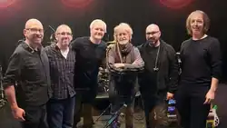 Promotional photograph of The Band Geeks with Jon Anderson