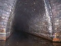 The Butterley Reservoir adit where it enters the Butterley Tunnel about 600 yards (550 m) along the tunnel from the western portal in 2006