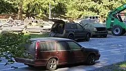 Several broken cars on a highway