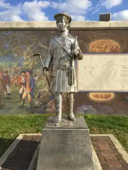 Statue of Lord Dunmore at Point Pleasant, in front of the flood wall mural