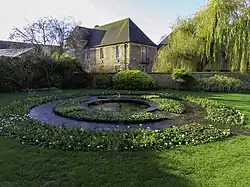 The original Serpent Fountain, now in the Christ Church War Memorial Garden