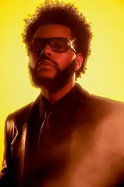 Canadian singer the Weeknd was the first artist of the decade to achieve a Billboard number-one single of the year (for the year 2020) with his hit single "Blinding Lights", which was also performed during the Super Bowl LV in 2021.