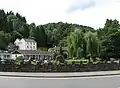 Looking up the Angidy valley from the A466. The Royal George hotel (1598) is at the left before the large white building, Crown Lodge (1800), both scheduled monuments.