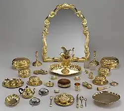 The set is mostly in silver-gilt, but includes two Japanese Imari ware teacups