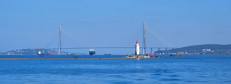 Russky Bridge behind the Tokarevsky Lighthouse