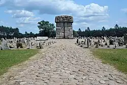 Monument designed by Franciszek Duszeńko, surrounded by memorial stones