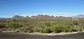 The foothills south of the Tucson Mountains. Beehive Peak is at the center-left, Cat Mountain is at the far left. The Catalina Mountains are in the background at right.