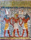 Ramesses I (middle) being accompanied by Horus (left) and Anubis (right)