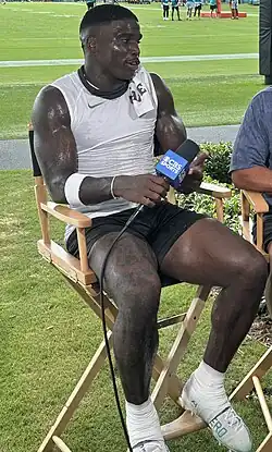 Tyreek Hill being interviewed by CBS Sports at Miami Dolphins training camp in July 2025