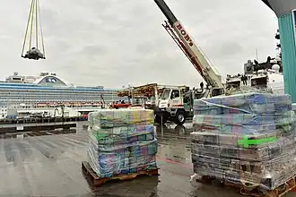U.S. Coast Guard Cutter Bertholf crewmembers offload approximately 14 tons of cocaine