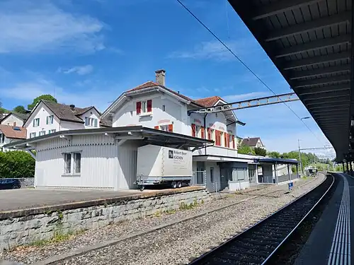 Two-story building next to double-track railway line