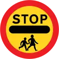 Stop, children crossing ahead (This sign can only be displayed by a person at a patrolled crossing).