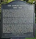 Frontside of a plaque outside the Armory