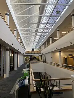 A photo looking down the atrium of the Harry Fairhurst Building library looking up at the glass celling