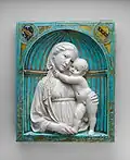 Virgin and Child in a niche by Luca della Robbia (c. 1460)