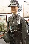 Enlisted "frontkjemper" ("Frontfighter" a Norwegian Waffen-SS volunteer) SS-Mann (private) of the Regiment Nordland, with medals, badges and other memorabilia; Lofoten War Museum, Norway.