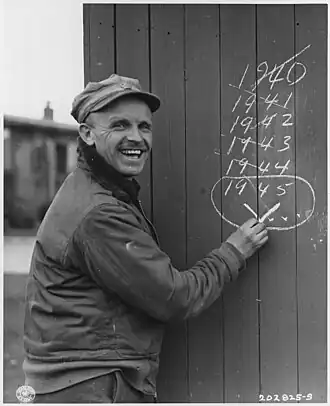 Sgt. Edward Hill of Manchester, England, freed from five years of captivity at Dulag Luft, by the American Seventh Armored Division, First Army, circa 29 March 1945