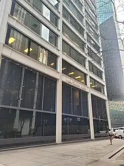 Side view of Wall Street Plaza ground floors from 88 Pine Street Plaza. Continental Center is in the far right background.