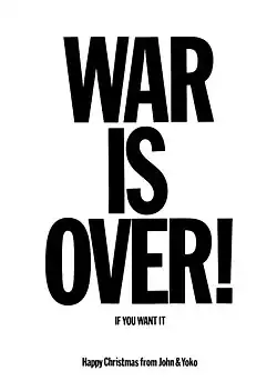 The words "WAR IS OVER!" written in large black text on a white background. Beneath it in smaller letters is written: "If You Want It – Happy Christmas From John and Yoko"
