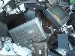 Waste electrical items accumulate at a dump.