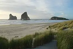 Wharariki Beach and three of the four Archway Islands